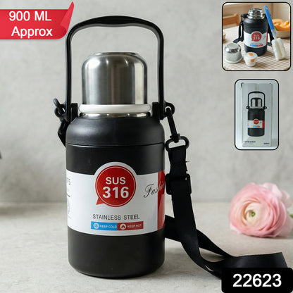 Wukusy premium stainless steel vacuum-insulated bottle with handle, 900ml capacity, featuring a sleek design and secure lid.