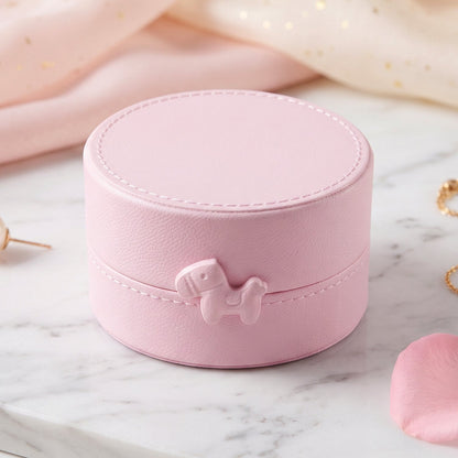 Small round Wukusy jewelry storage box with snap closure, portable organizer case for jewelry and accessories.