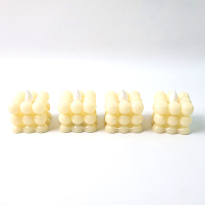 Set of four decorative LED bubble candles by Wukusy, designed for home decor with glowing, bubble-like features.