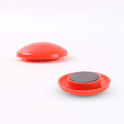 Red circular plastic magnet with Wukusy branding, featuring a smooth surface and embedded magnetic backing.
