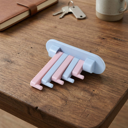 Wall-mounted foldable towel holder rack by Wukusy, showing the sleek, space-saving design with multiple metal bars for towels.