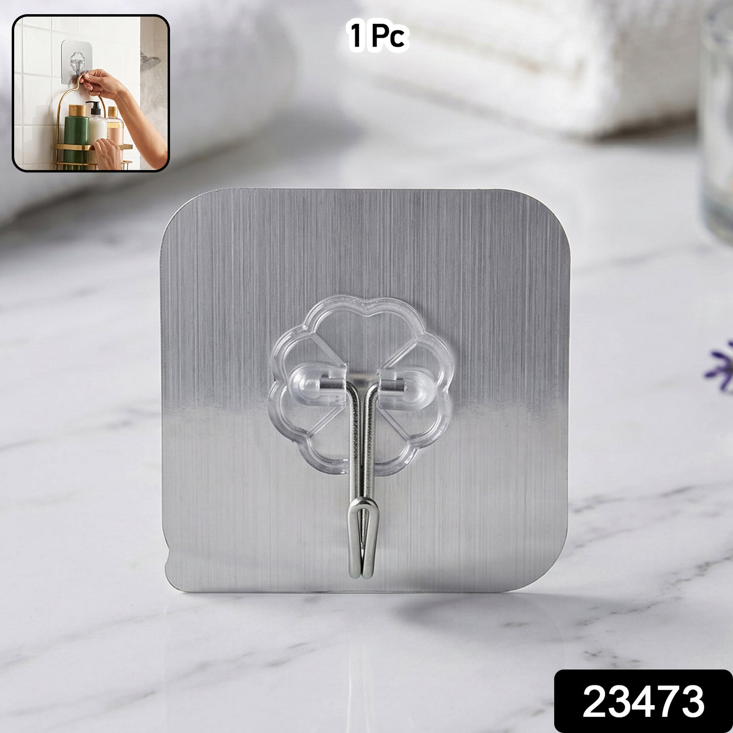 Transparent heavy-duty self-adhesive wall hook from Wukusy mounted on a wall, showing its clear design and strong adhesive backing.