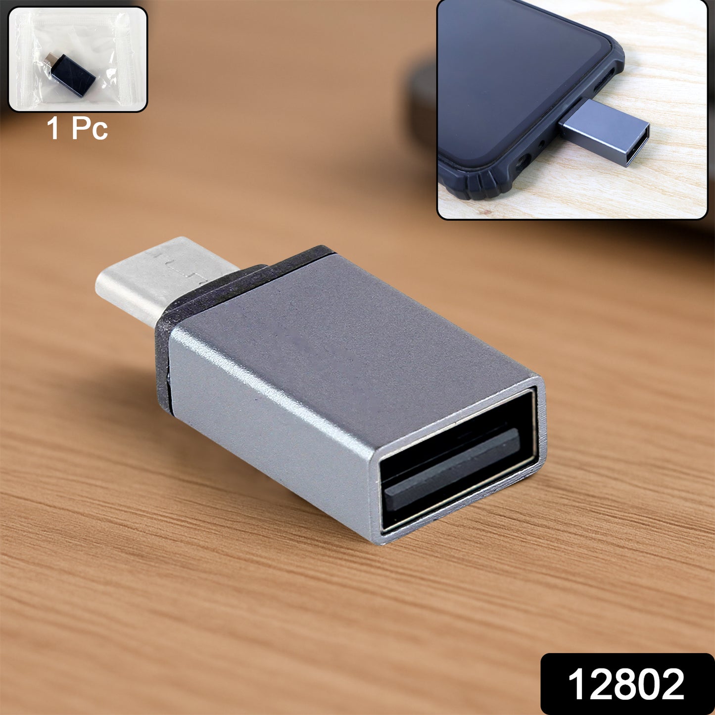 Wukusy Type-C OTG adapter pen drive connected to a smartphone, compact black USB-C to USB flash drive accessory.