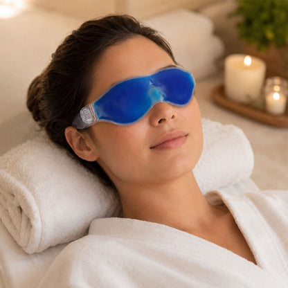 Small Wukusy blue eye mask with cooling gel for relaxation and puffy eye relief, shown resting on a soft surface.