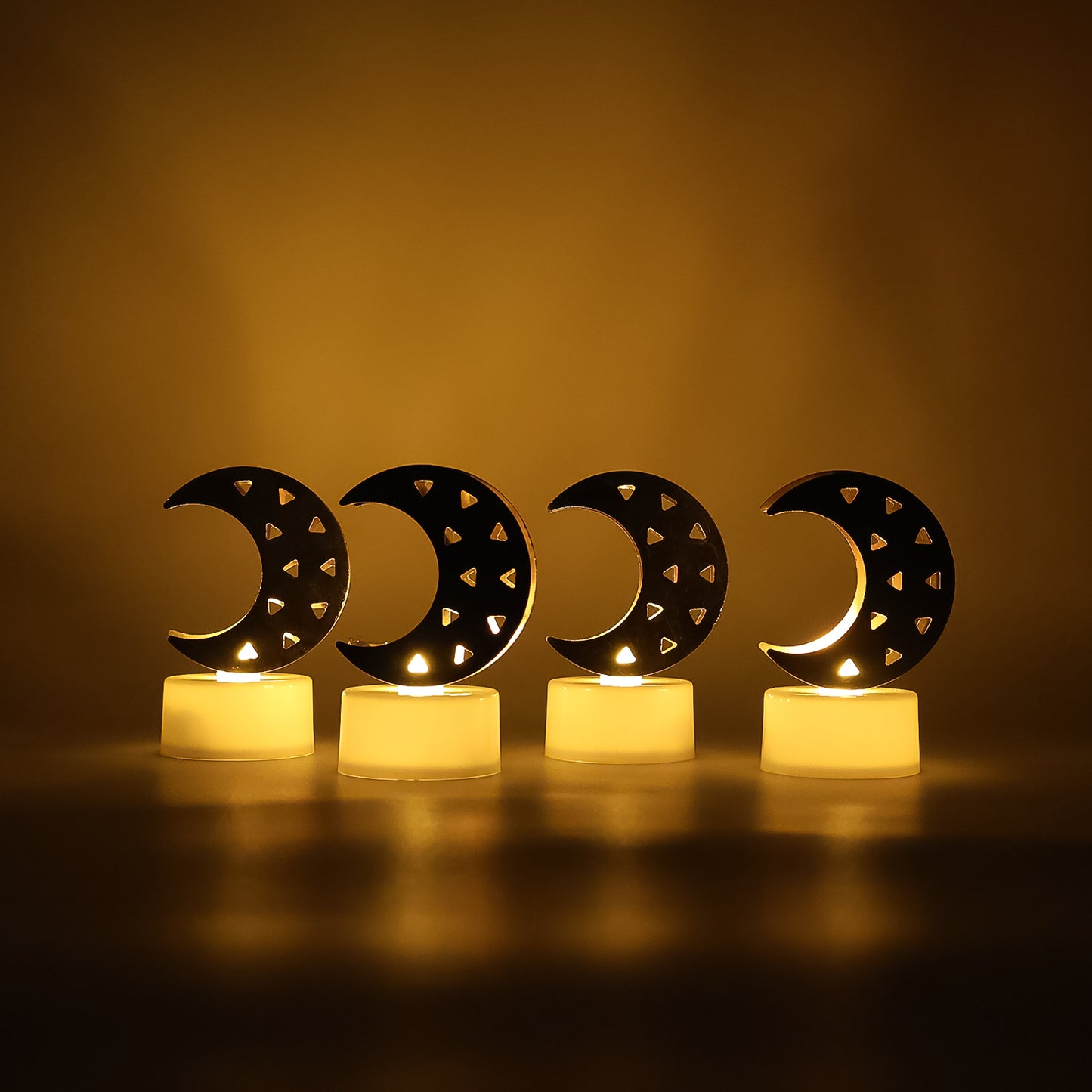 Set of four moon-shaped flameless LED candles by Wukusy, ideal for home decor with soft glowing light.