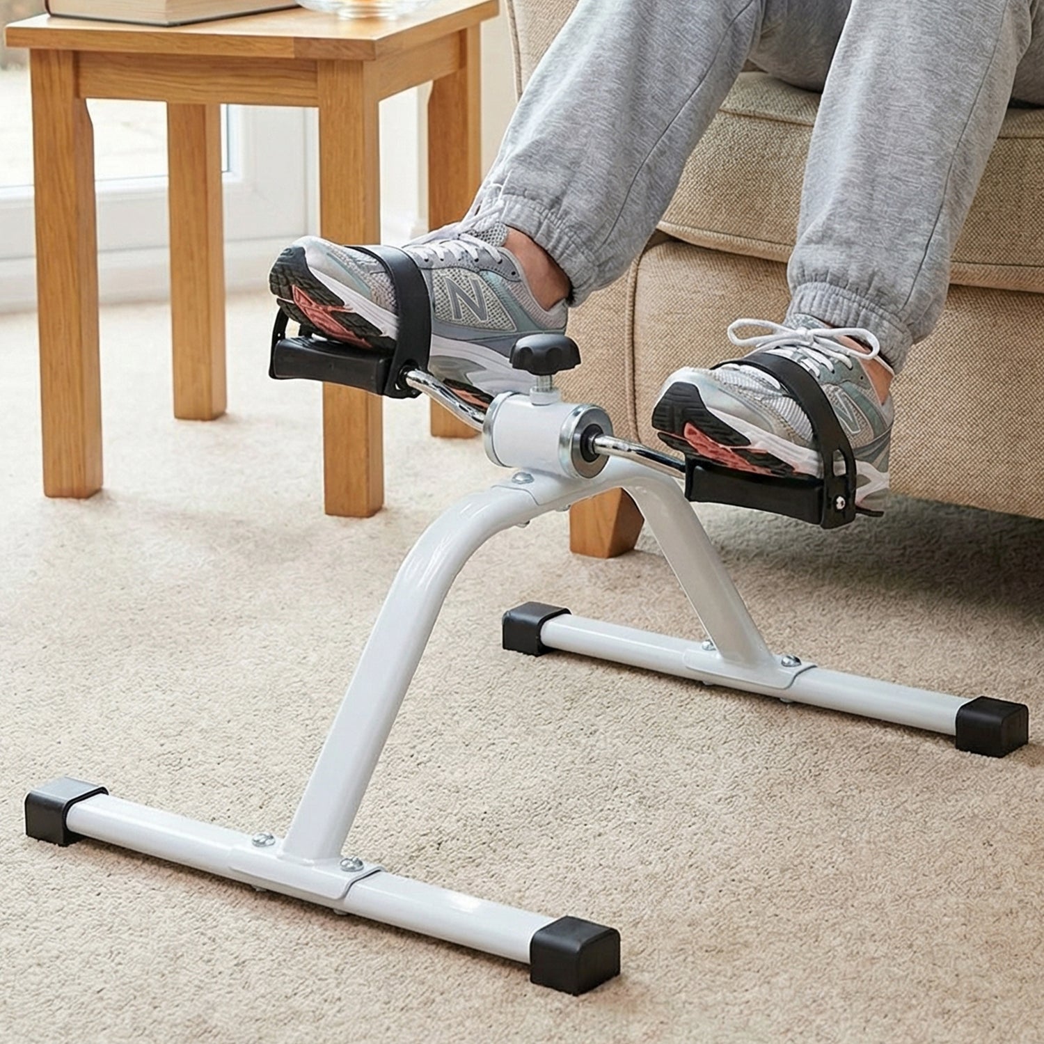 Wukusy mini pedal exerciser cycle for portable fitness, showing compact pedal machine with adjustable straps and sturdy frame.