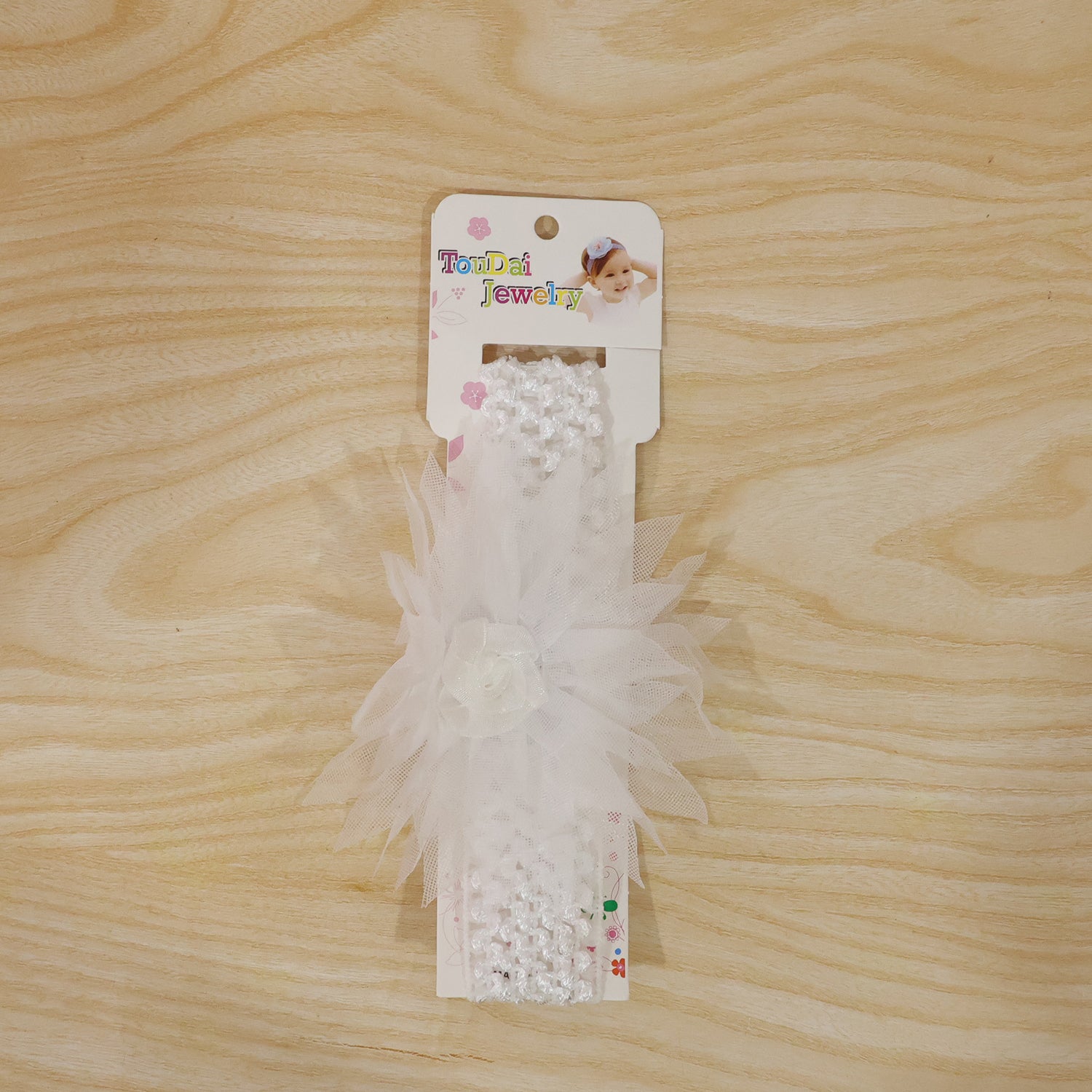 Soft elastic floral baby headband by Wukusy, stylish stretchable hair band with cute floral design for infants.