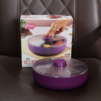 Wukusy Supermom multipurpose round rotating dry fruit and snack storage container with lid, in a kitchen setting.