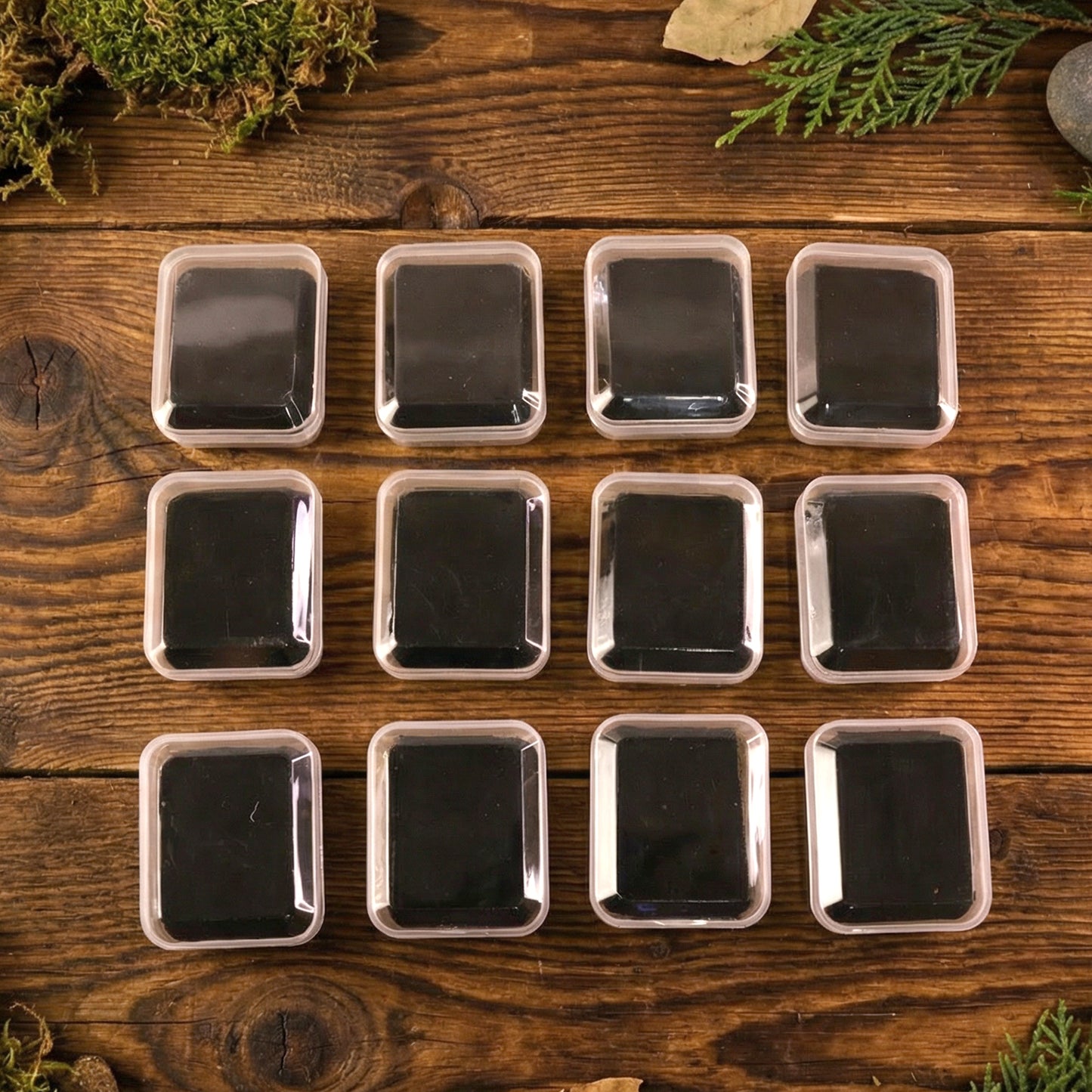 Wukusy mini jewelry storage box with 12 compartments for rings, earrings, and small accessories, showing organized jewelry pieces.