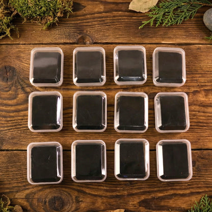 Wukusy mini jewelry storage box with 12 compartments for rings, earrings, and small accessories, showing organized jewelry pieces.