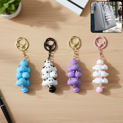 Colorful cartoon cloud stack keychain with bell from Wukusy, featuring mixed bright colors and a small bell attachment.