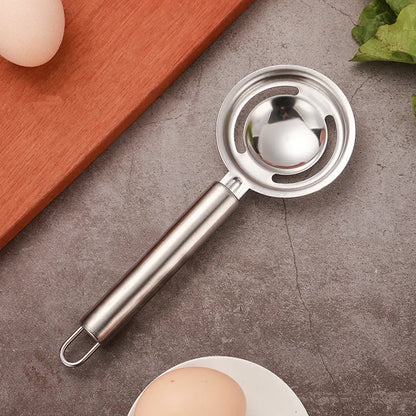 Wukusy stainless steel egg yolk and white separator with funnel and spoon, ideal kitchen gadget for separating eggs efficiently.