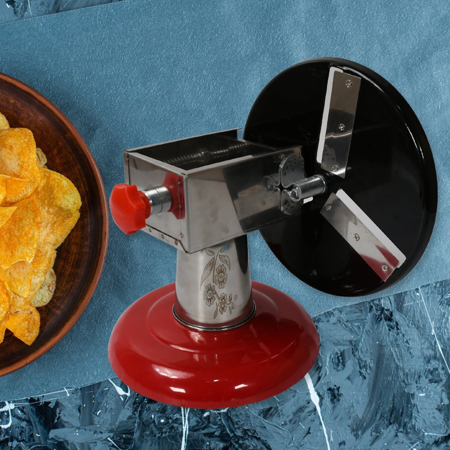Wukusy stainless steel chips maker and vegetable slicer with iron wheel and stand for potato and vegetable cutting in the kitchen.