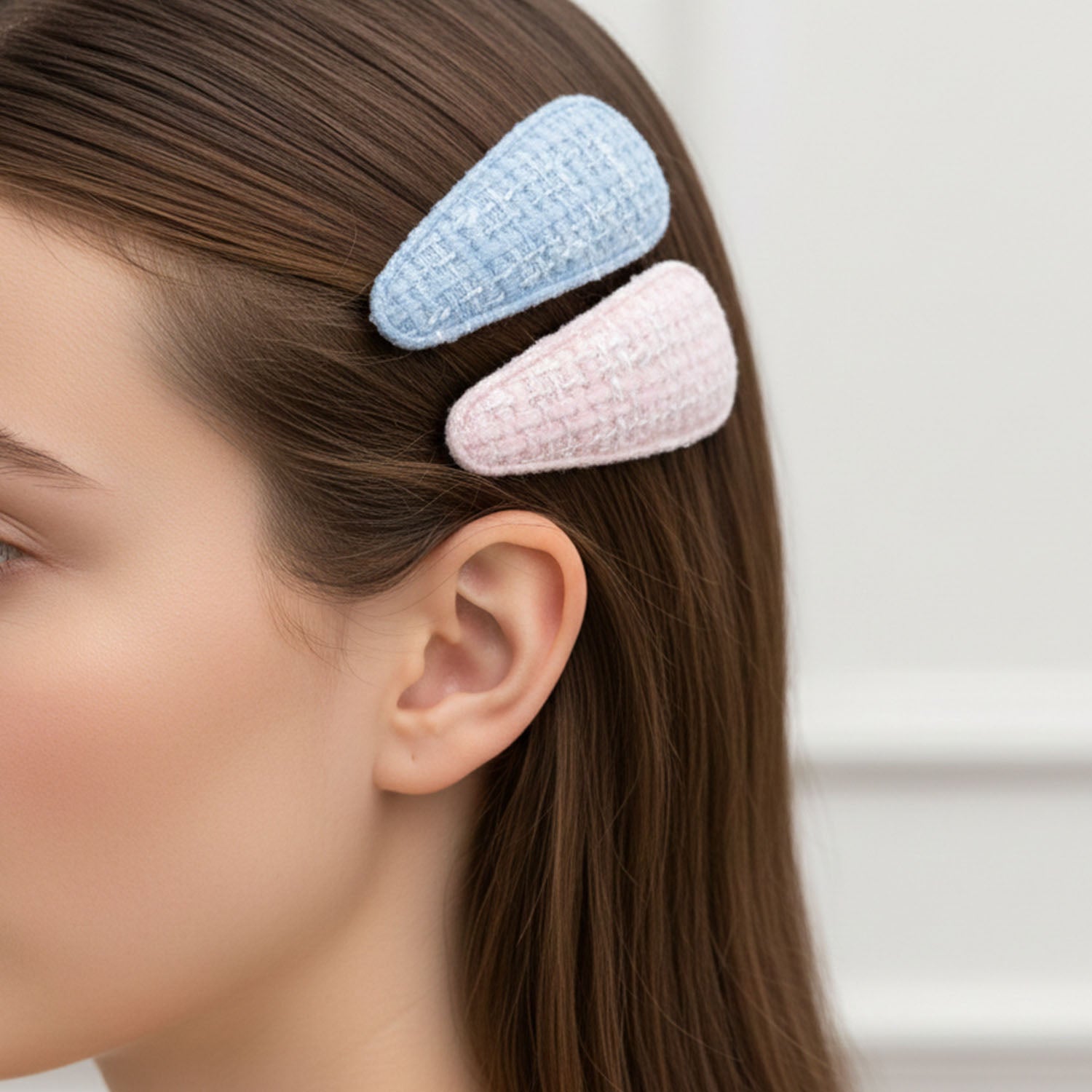 Set of four Wukusy textured fabric snap hair clips in various neutral colors on a white background.