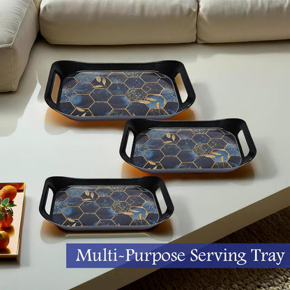 Three Wukusy premium plastic serving trays stacked, rectangular shapes with handles, in clear and vibrant colors.