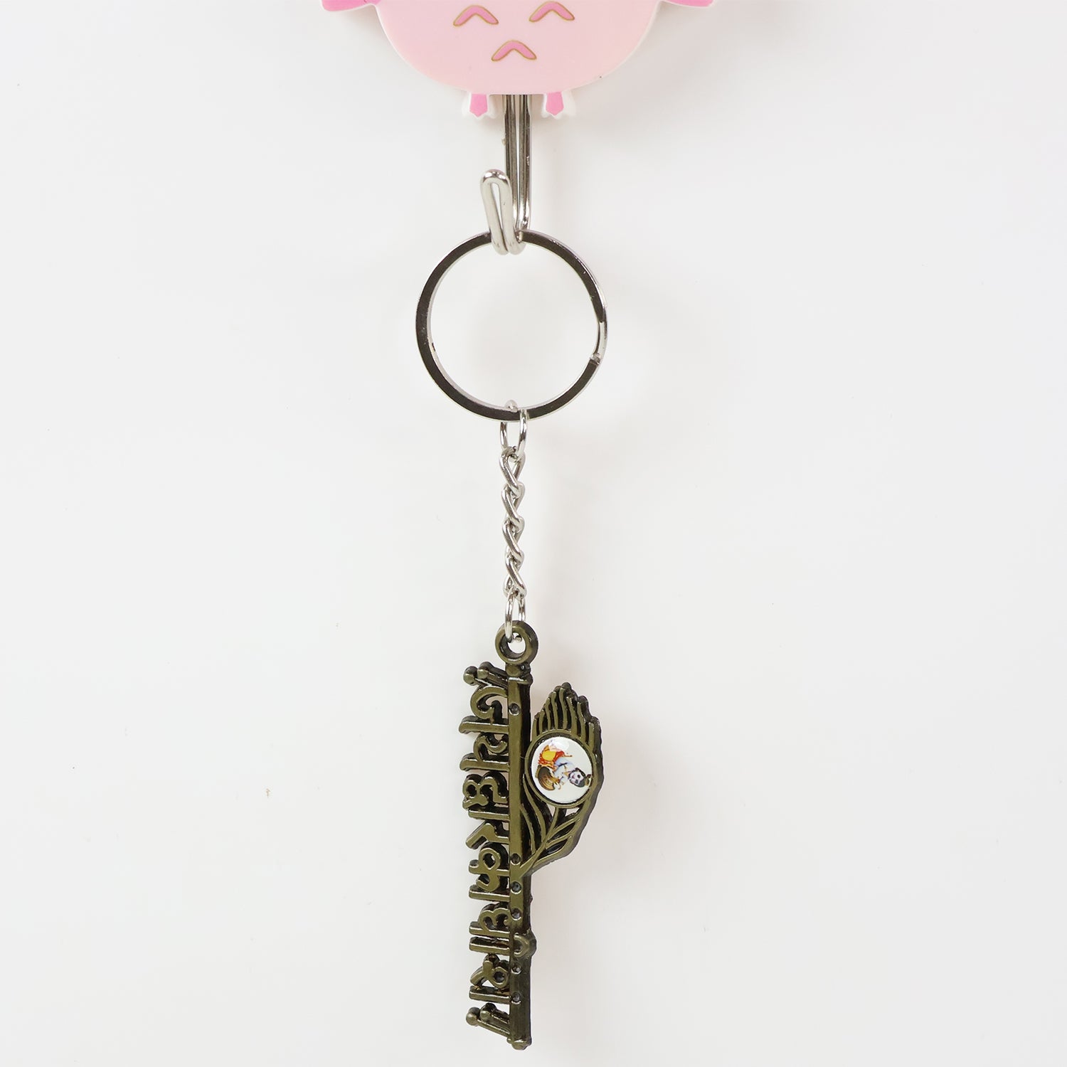 Wukusy Jai Dwarkadhish metal keychain featuring intricate design, ideal for religious or decorative use.