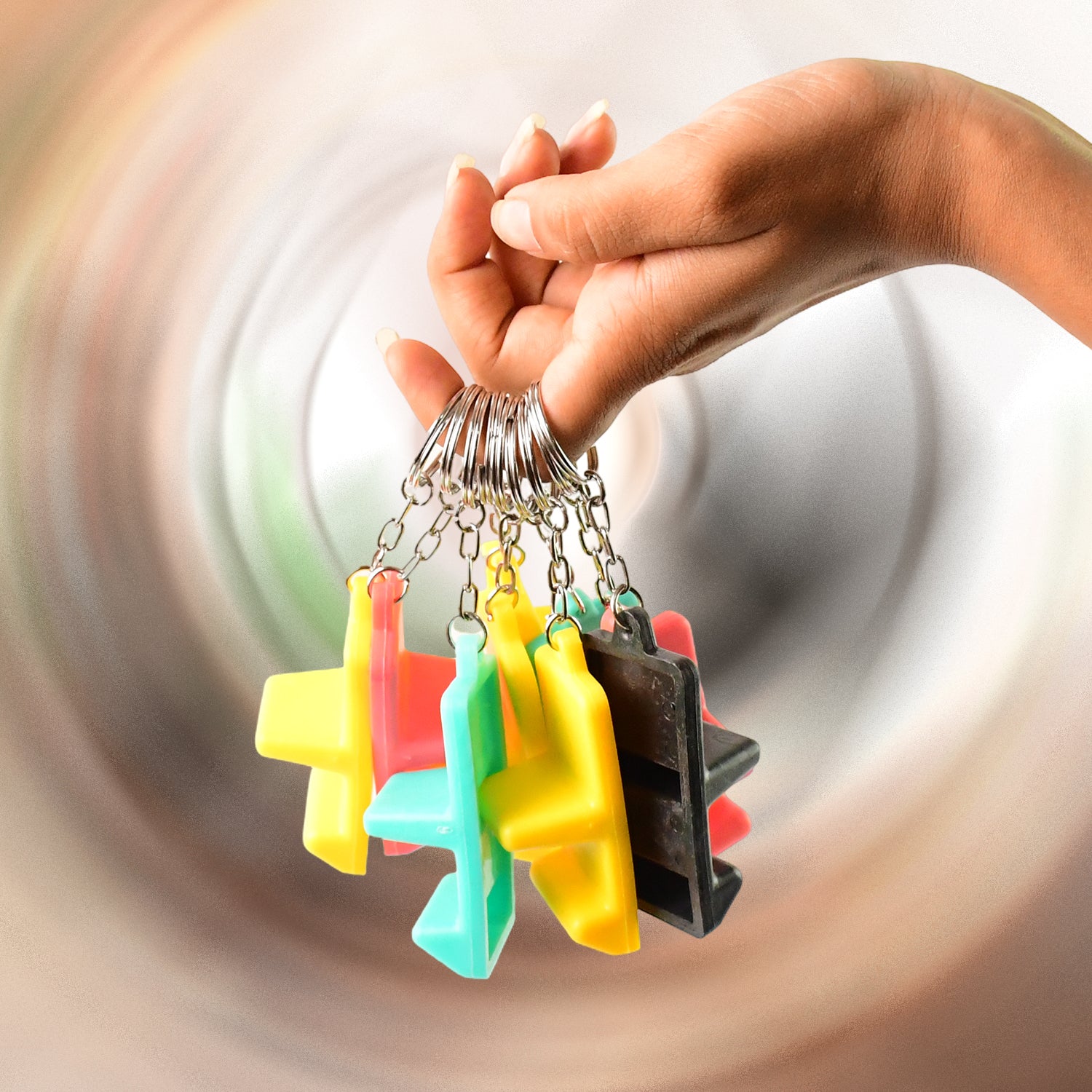 Wukusy plastic 2-in-1 mobile stand keychain with nine pieces, compact mobile accessory for hands-free use and key organization.