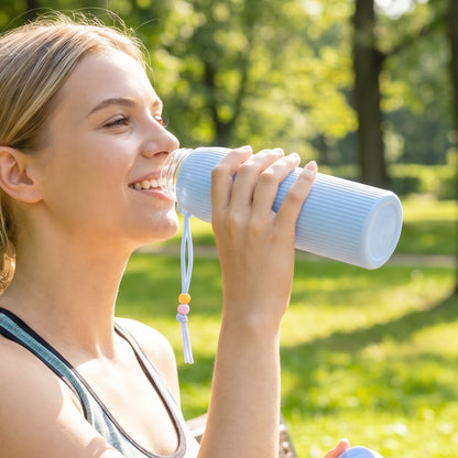 Wukusy premium textured glass water bottle, 300ml capacity, with a clear, stylish design and textured surface for grip.