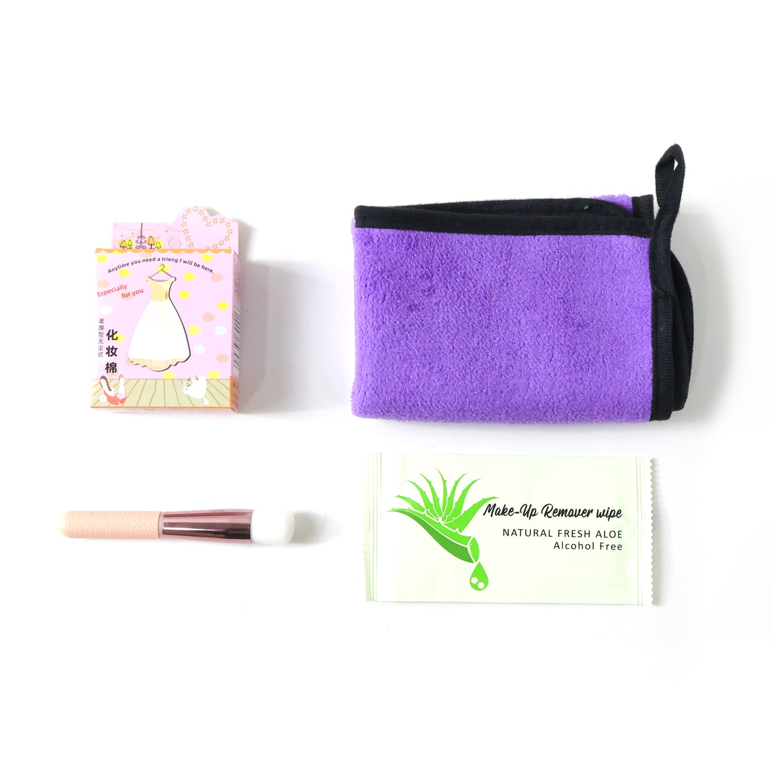 Wukusy 4 in 1 beauty care essentials gift set with skincare bottles and tools arranged on a white background