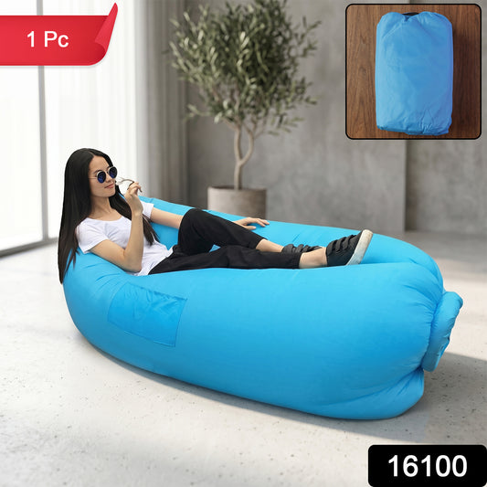 Wukusy inflatable air lounger sofa for outdoor camping, beach, and pool, shown fully inflated on grass with blue sky background.