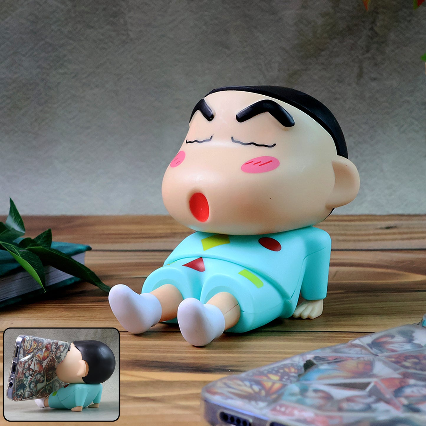 Cute cartoon figurine mobile phone stand by Wukusy, featuring a colorful character design on a clear base.