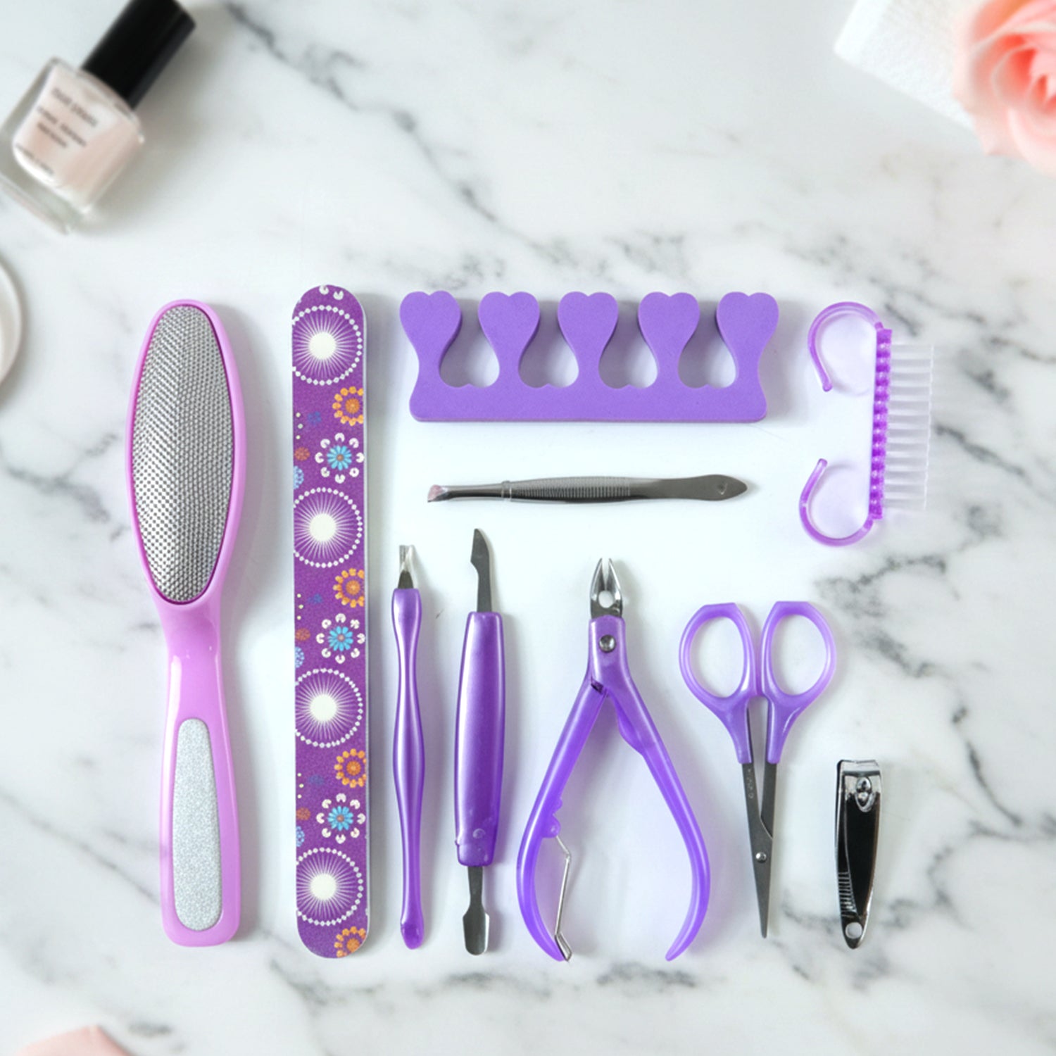 Wukusy 10-piece personal grooming manicure and pedicure nail care tool set with clippers, files, and cuticle tools on white background.
