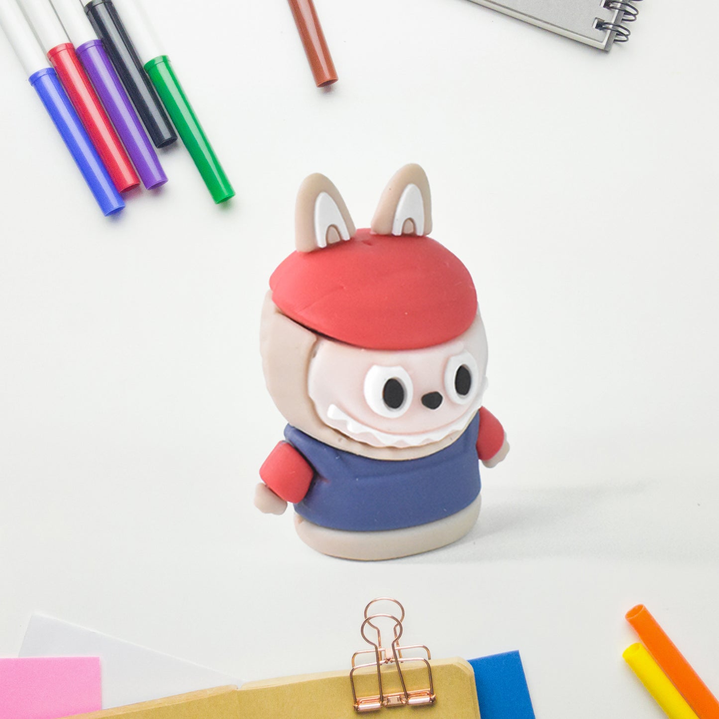 Wukusy cartoon-shaped pencil sharpener with built-in eraser, colorful fun stationery for office or school use.