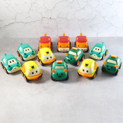 Set of 12 Wukusy cartoon pull-back toy cars for kids, colorful plastic cars with animated designs on a white background.