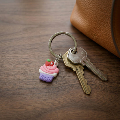 Set of 10 cute cupcake-shaped bag charm keychains by Wukusy featuring colorful and adorable cupcake designs.
