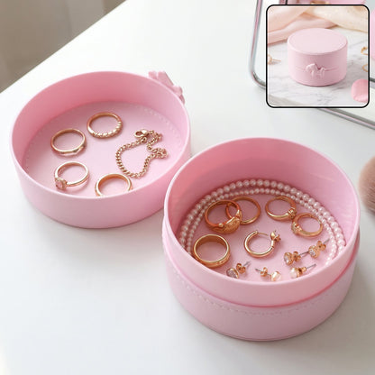 Small round Wukusy jewelry storage box with snap closure, portable organizer case for jewelry and small accessories.