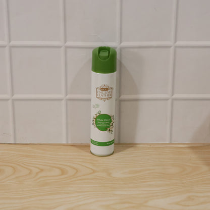 Wukusy Next English Leather Floral Rajnigandha air freshener spray bottle, 220ml, with white floral design on the label