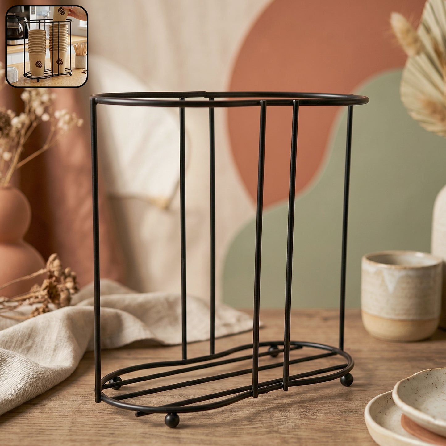 Wukusy metal desktop water cup holder with a sleek design, holding a drinking cup securely on a desk.