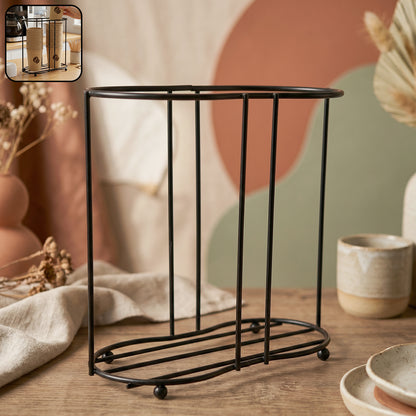 Wukusy metal desktop water cup holder with a sleek design, holding a drinking cup securely on a desk.