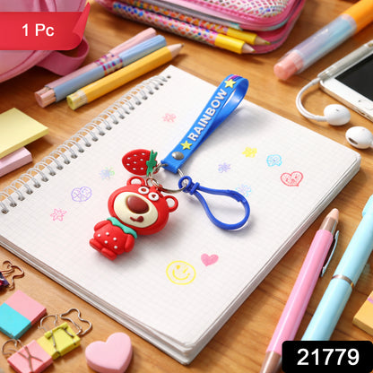 Cute teddy bear keychain with rainbow strap from Wukusy, featuring a soft plush teddy bear attached to a colorful rainbow strap.