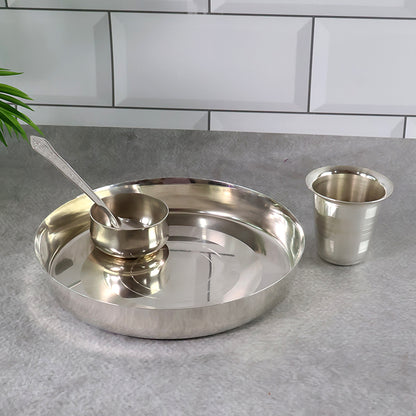 Stainless steel Pooja Thali set with decorative design, ideal for prayer and religious rituals at home.
