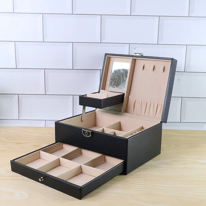 Wukusy multi-layer jewelry organizer box with compartments for rings, necklaces, and earrings, made of black faux leather.