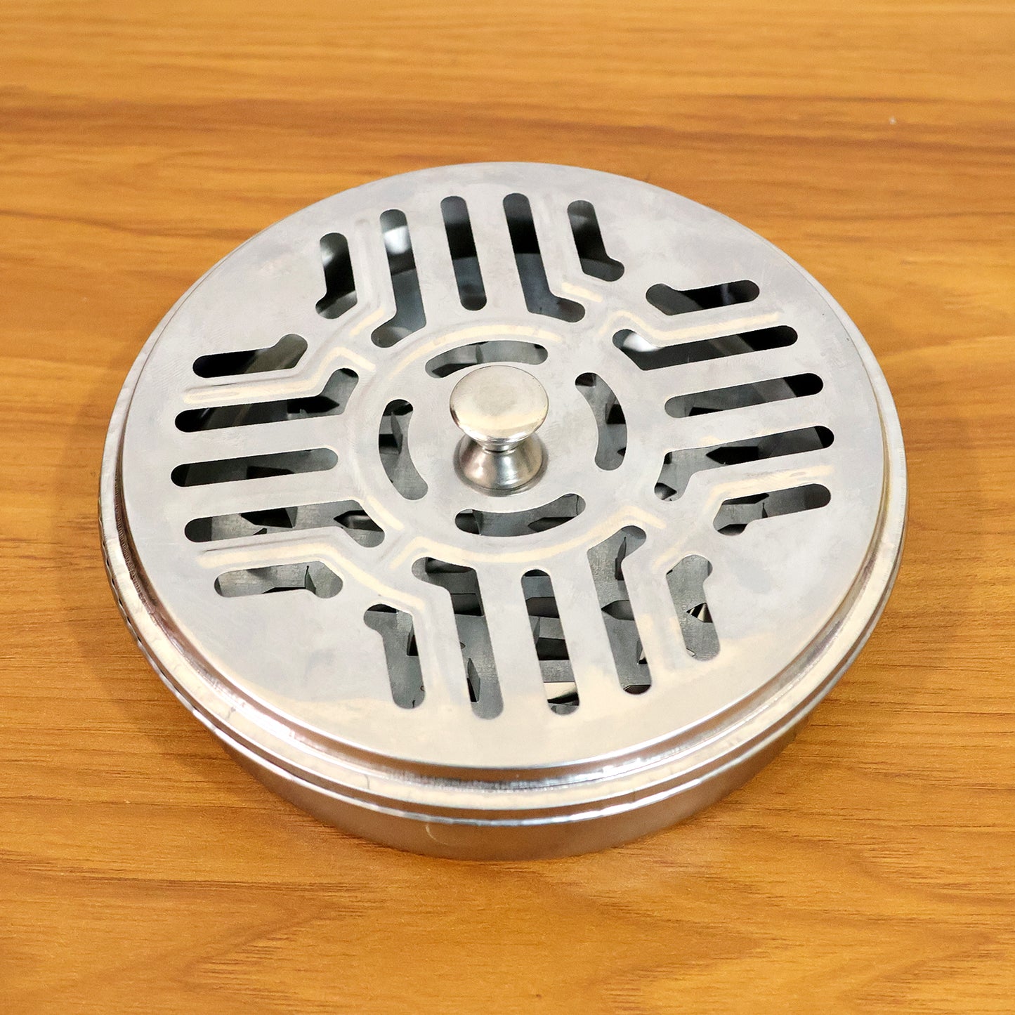 Wukusy stainless steel mosquito coil stand with smoke vent lid, designed to hold mosquito coils safely and improve airflow.