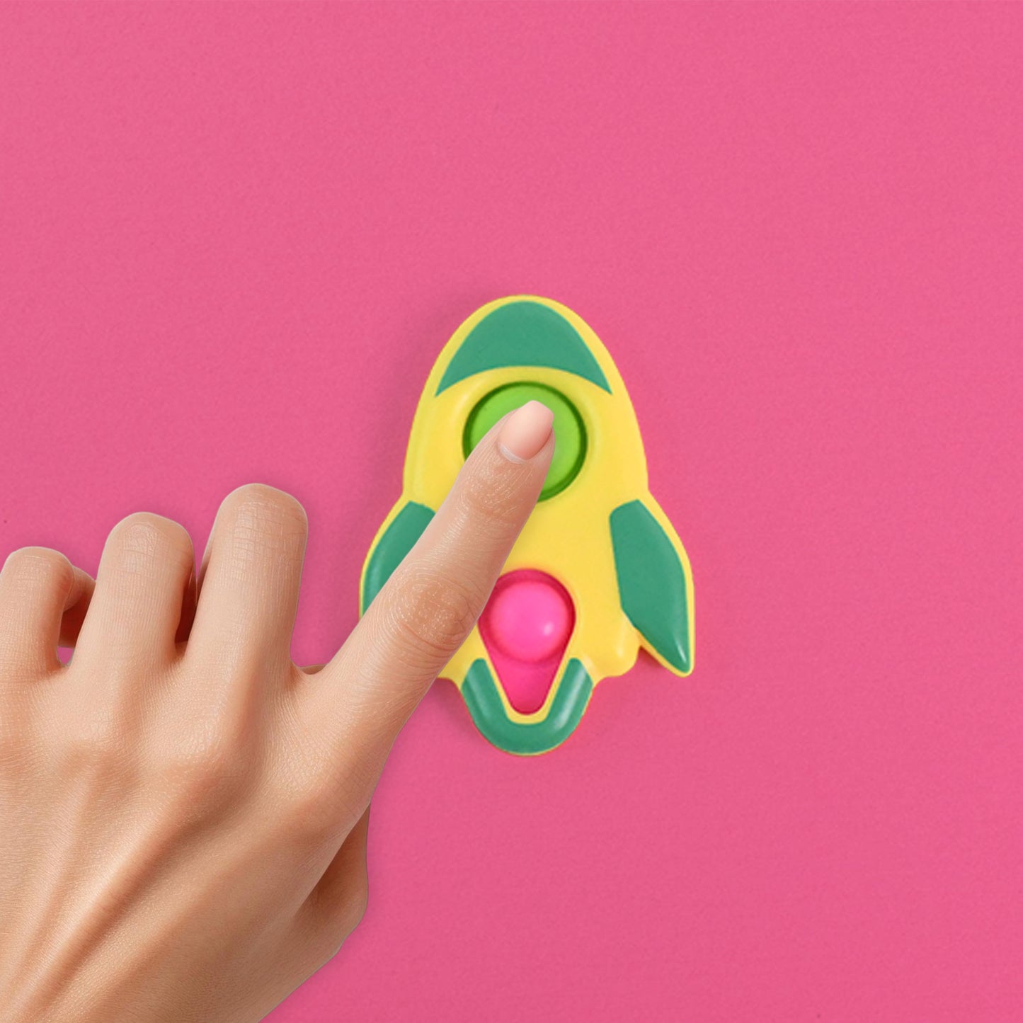 Wukusy rocket-shaped dimple keychain toy, colorful plastic design with textured dimples, attached to a keyring.