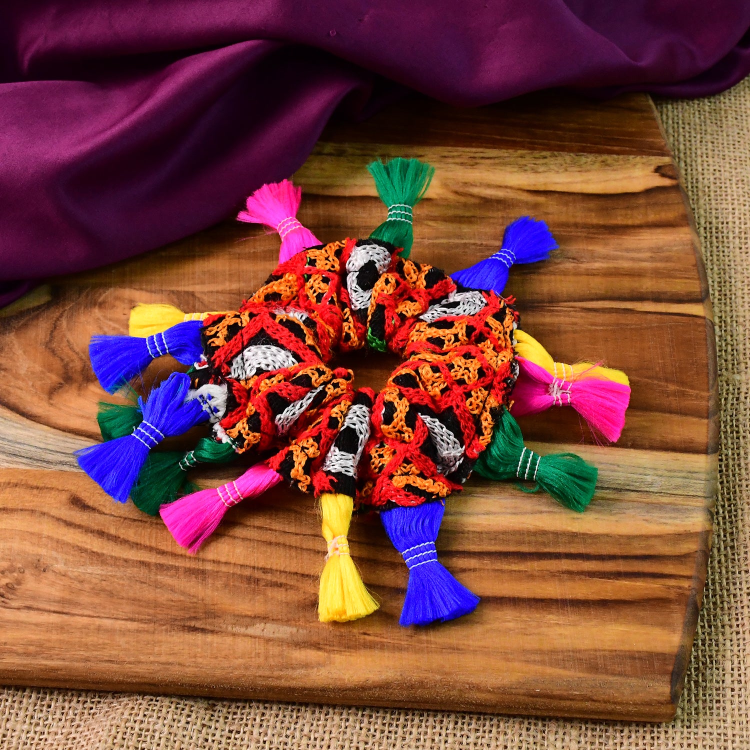 Multicolor Navratri hair bun accessory by Wukusy for traditional health and beauty celebrations, featuring vibrant multicolor design.