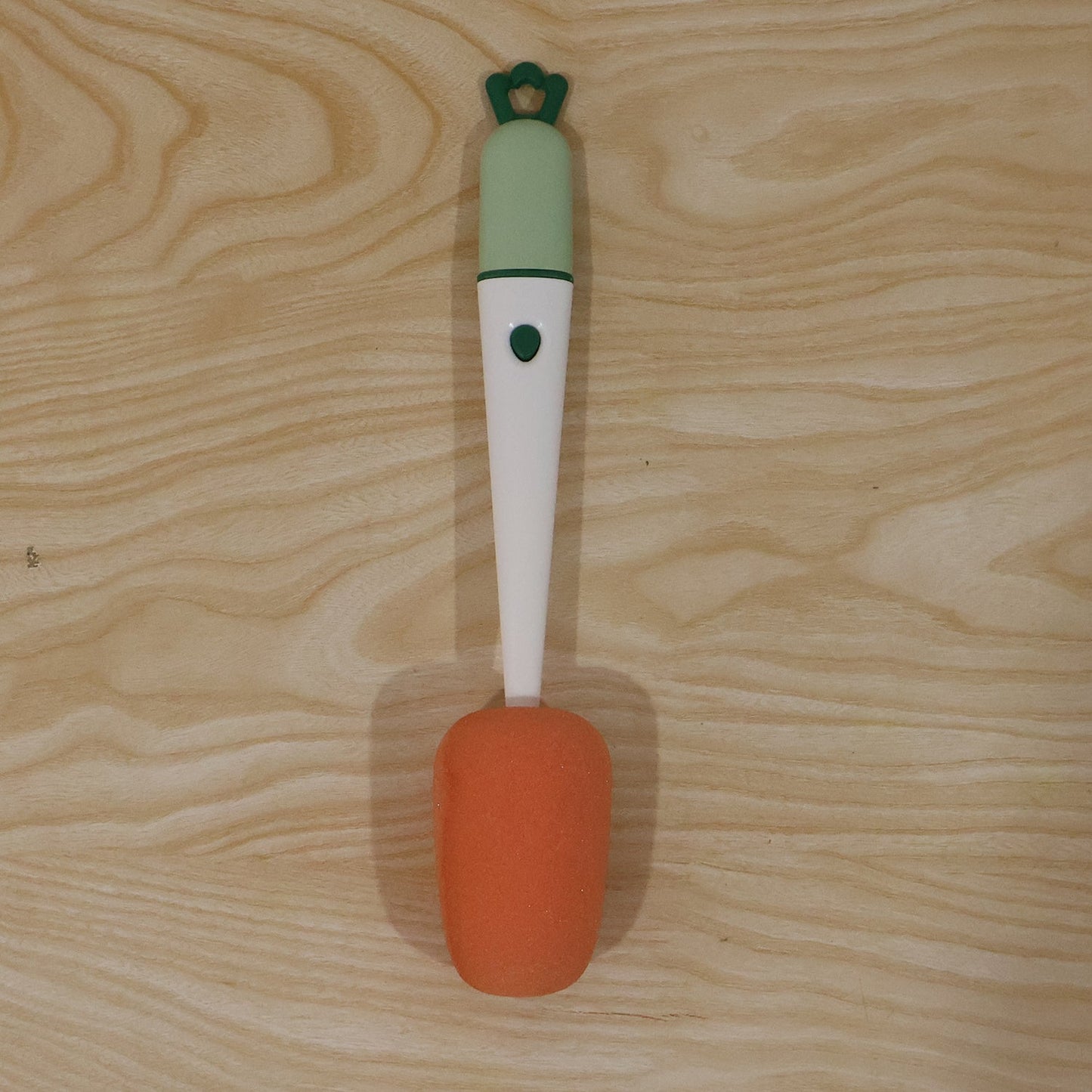 Wukusy 3-in-1 carrot-shaped cleaning brush with sponge for cups and flasks, showing brush and sponge parts in a car interior setting