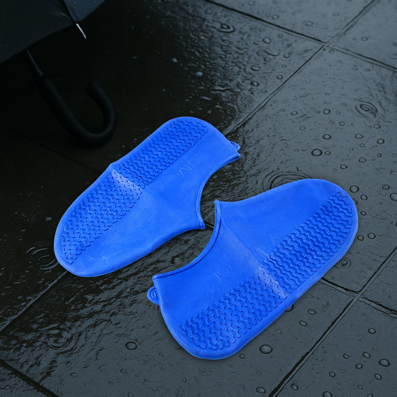 Pair of Wukusy blue waterproof silicone rain boot covers with non-slip soles, foldable and reusable for travel and outdoor use.