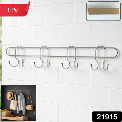 Stainless steel wall-mounted hook rack with multiple hooks for hanging items, branded Wukusy, mounted on a wall.