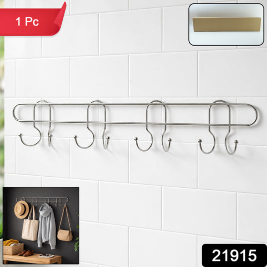Stainless steel wall-mounted hook rack with multiple hooks for hanging items, branded Wukusy, mounted on a wall.