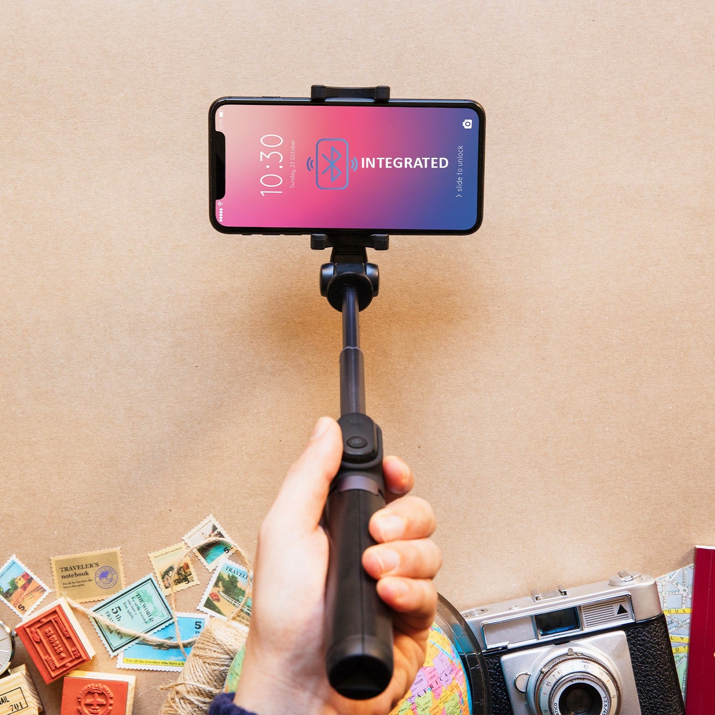 Wukusy Bluetooth selfie stick and portable phone tripod stand for mobile phones, with adjustable arm and compact design.