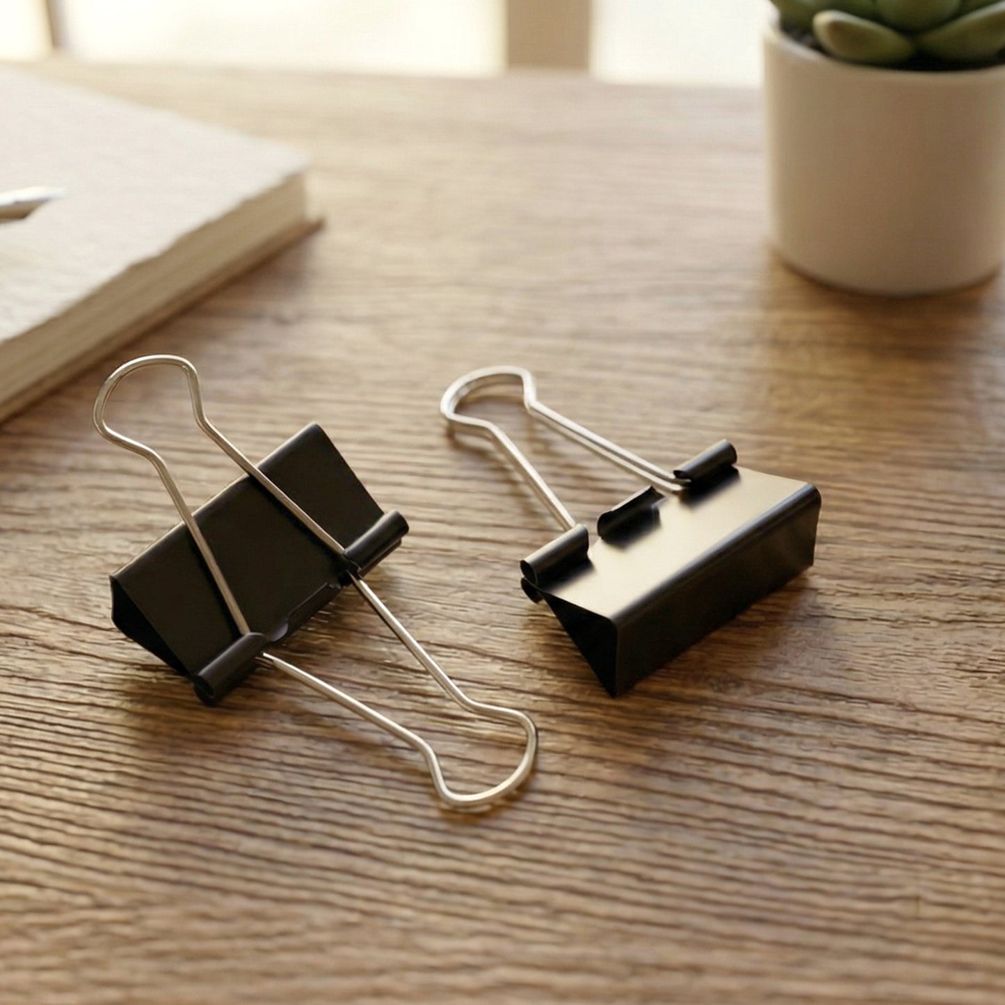 Set of 12 black heavy-duty binder clips, 32mm size, by Wukusy, suitable for securing papers and documents.