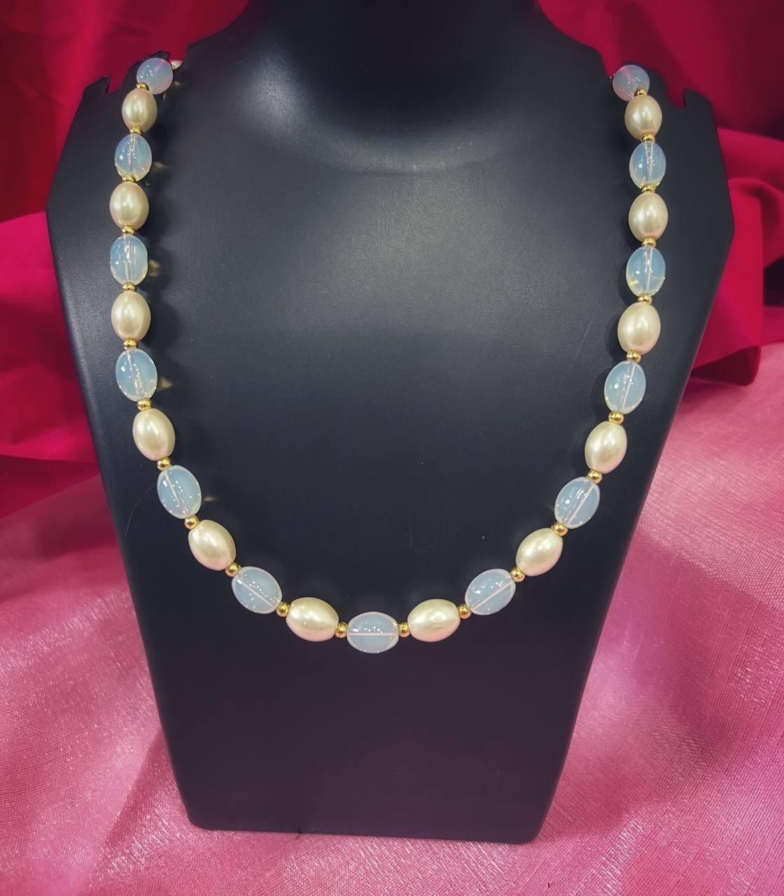 Drpshippr PD Enterprise Mala Pearl Gold-Plated Necklace with intricate design and lustrous pearls on a delicate chain.