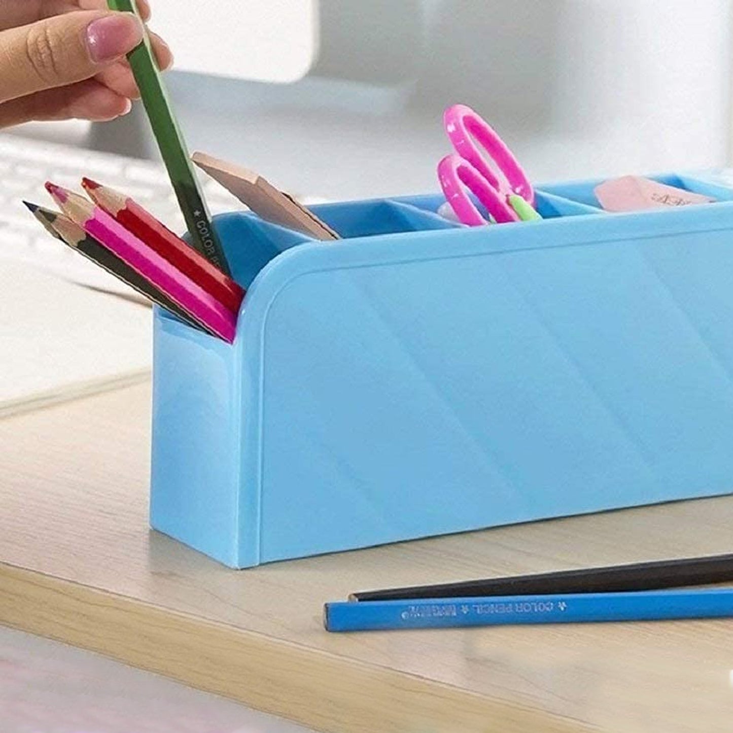Wukusy multipurpose 4-compartment pen holder for office desk organization, holding pens, pencils, and small office supplies.