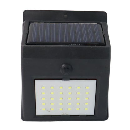 Wukusy solar powered LED wall light for garden, wall-mounted outdoor lighting with solar panel in a garden setting