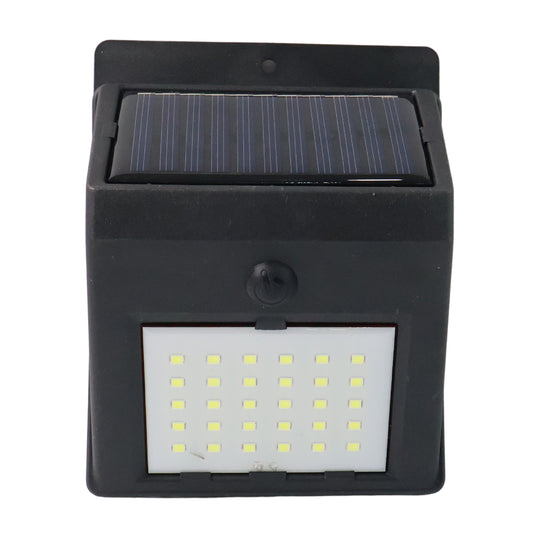 Wukusy solar powered LED wall light for garden, wall-mounted outdoor lighting with solar panel in a garden setting