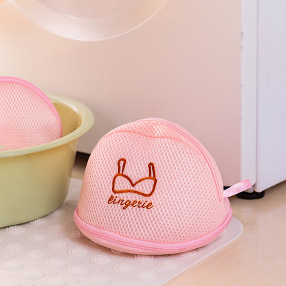 Wukusy dome-shaped lingerie wash bag made of protective mesh for delicate laundry, shown in a close-up image.